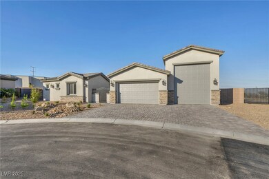 View of front of house featuring stone siding, an