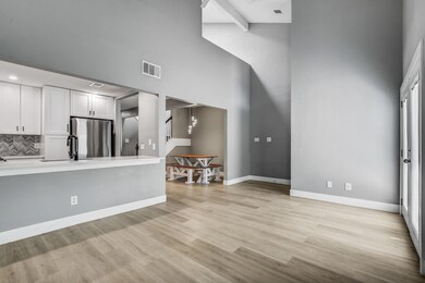 Unfurnished living room with light wood-style flo