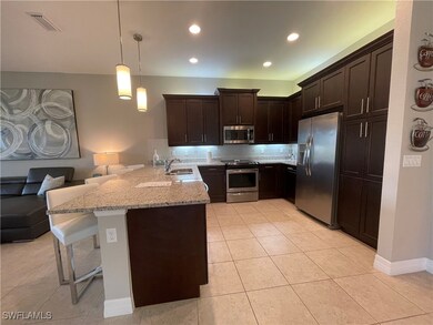 Kitchen featuring stainless steel appliances, a pe