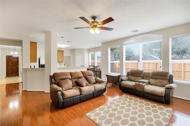 Gorgeous wood flooring, open concept and plenty of natural light from all those lovely windows!