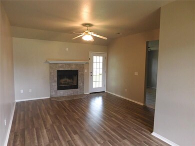 Very large family/living room with new flooring, new tile front on the wood burning fireplace with gas starter.