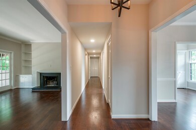 The foyer overlooks the dining room to the right and the living room to the left. 