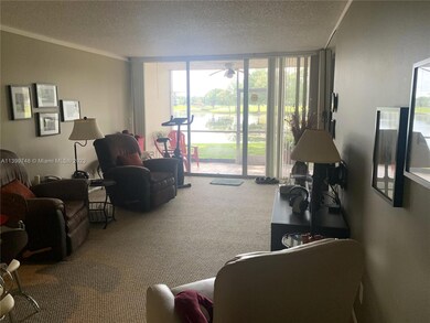 LIVING/DINING AREA OVERLOOKS LAKE.