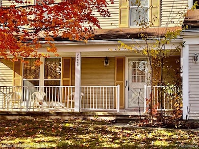 View of exterior entry with covered porch
