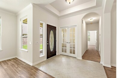 Plenty of windows and a leaded glass front door let the natural light in!