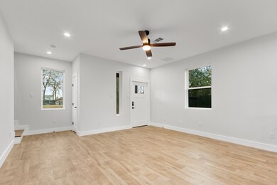 Living room, kitchen, and dining area are all loca