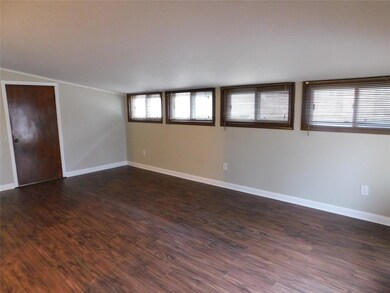 Large extra living space can be used as den or din