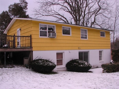 Exterior back. Sliding doors from basement.