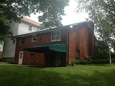 Exterior Back. Awning covers your back patio for summer enjoyment.