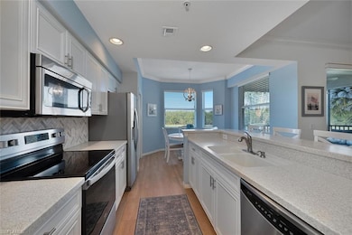 Freshly painted cabinets and new range and refrigerator