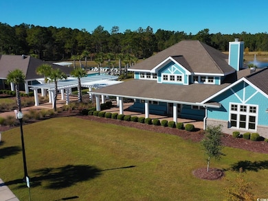 View of front of house featuring a front lawn, a pergola, a chimney, and roof with shingles