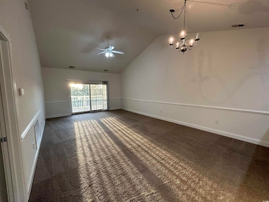 Carpeted spare room with lofted ceiling and ceilin