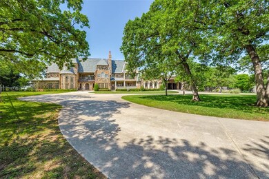 Sitting back about 500 feet from the road, this gated and fenced property offers a unique concrete drive that can accommodate over 50 vehicles.  An entertainer's dream!
