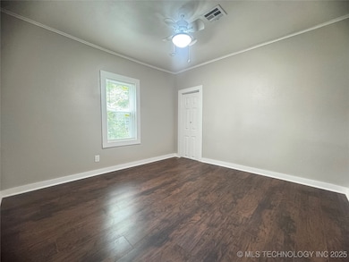 Unfurnished room with ceiling fan, ornamental mold