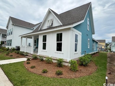 View of front of house with board and batten sidin