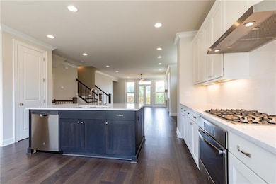 Kitchen with a sink, stainless steel appliances, a