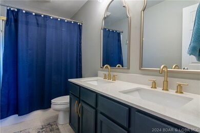 The master bath has his/her vanities, updated fixt