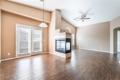 Unfurnished living room featuring dark wood-style
