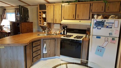 Gas stove and refrigerator included in this kitche