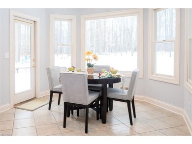 Eat-in area offers views of the woods and a walk-o