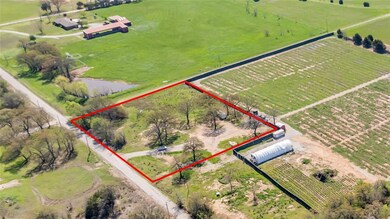 Birds eye view of property with a rural view