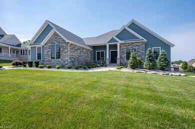 Hardie Board siding and stone on front and back of