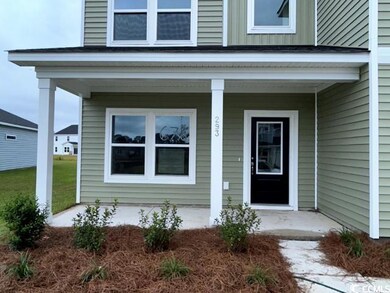 View of exterior entry featuring a porch