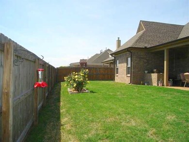 Pretty manicured backyard w/privacy wood fence.