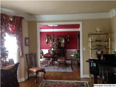 Living Room with bay window and view into formal D