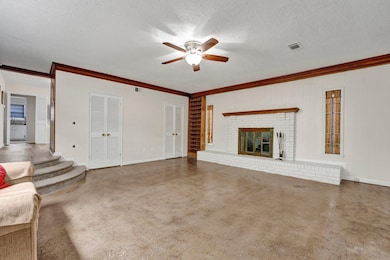 Unfurnished living room with visible vents, a ceil