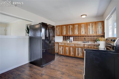 Kitchen w/ peek-through window to living room