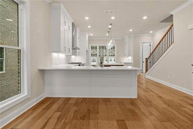 A nice view to the family room. *Please note that photos shown are representative of the floorplan but are not photos of the actual home available.