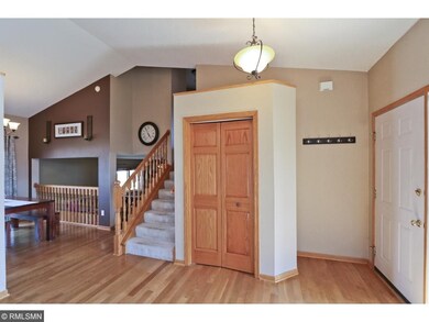 The home features a large entryway with vaulted ce