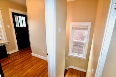 Office with coat closet-storage at top of stairs l