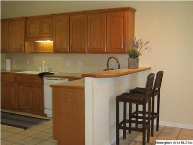 Bright kitchen with a bar for serving casually