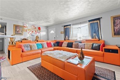 Living room featuring wood finished floors, a text