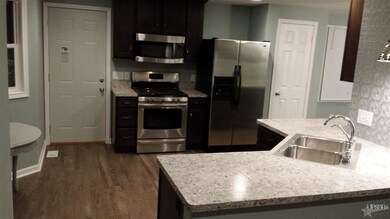 View of kitchen from dining/living area