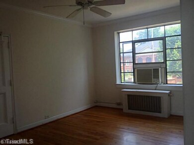Living Room. Lovely hardwoods, 9 ceilings, large window, and ceiling fan are just a few features in this spacious living room.