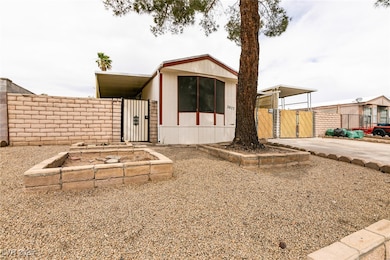 Manufactured / mobile home featuring a gate, fence