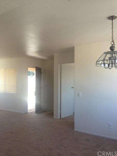 Entry and living room as seen from kitchen