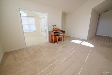 French doors lead to sunroom.