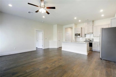 Kitchen with stainless steel appliances, a ceilin