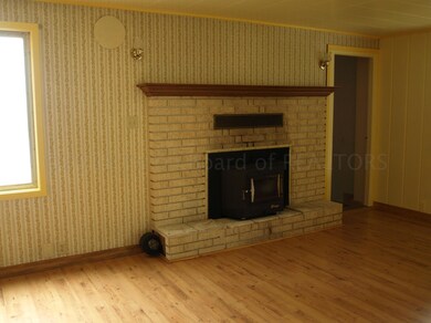 Family Room w/ Wood Fireplace
