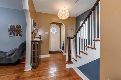 The front foyer has a small closet, stairway and a