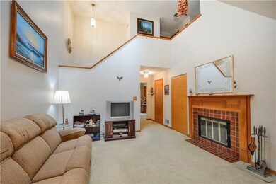 The living area is vaulted with an open staircase 