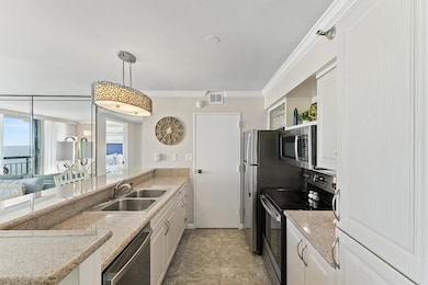 The galley kitchen boasts ample counter space and