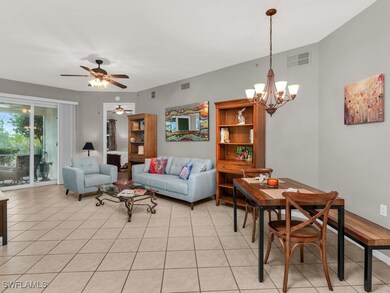 Tiled living room with ceiling fan with notable ch