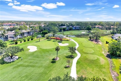 Aerial view of a golf course and a tree filled landscape