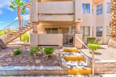 View of front facade featuring stairs, a gate, and