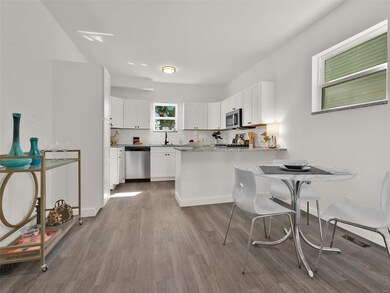 This kitchen has been remodeled from top to bottom.  Reconfigured to make it more functional.  Breakfast bar and lots of space for your dining table!  New countertops, SS appliances and cabinets make meal prep and entertaining easy.